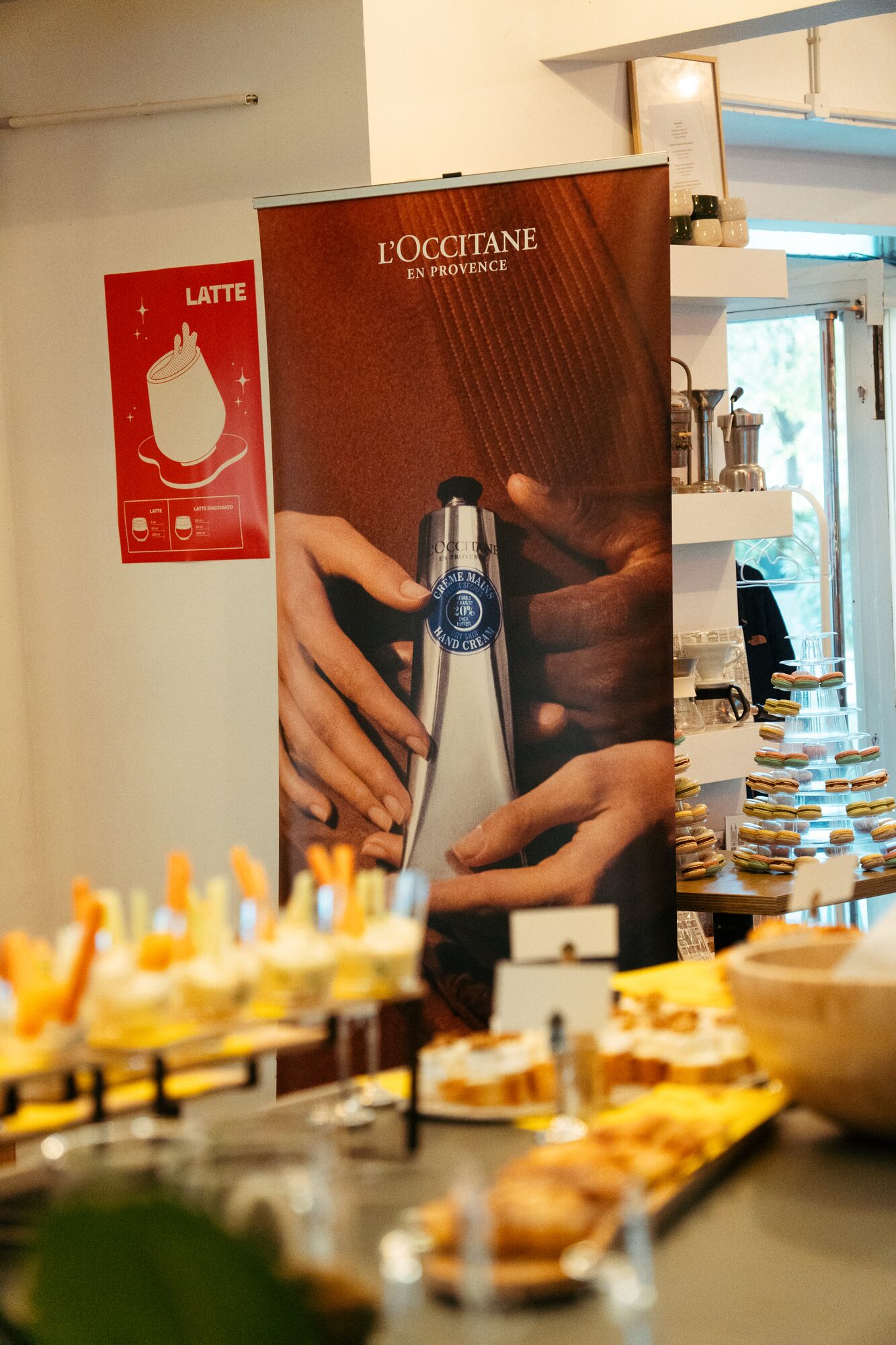 L'Occitane branded installation at Smúz Café Budapest — espresso machine and buffet